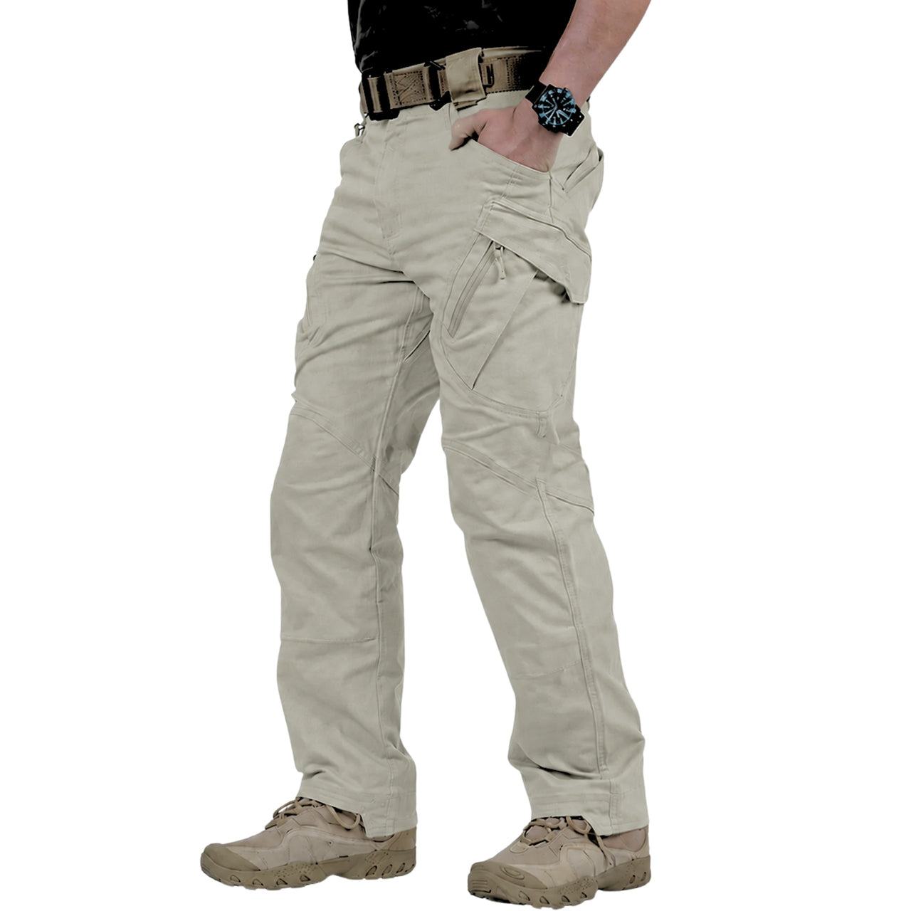 A person wearing light khaki tactical cargo pants, paired with a black shirt, brown belt, and tan combat boots, shown from the waist down on a white background.