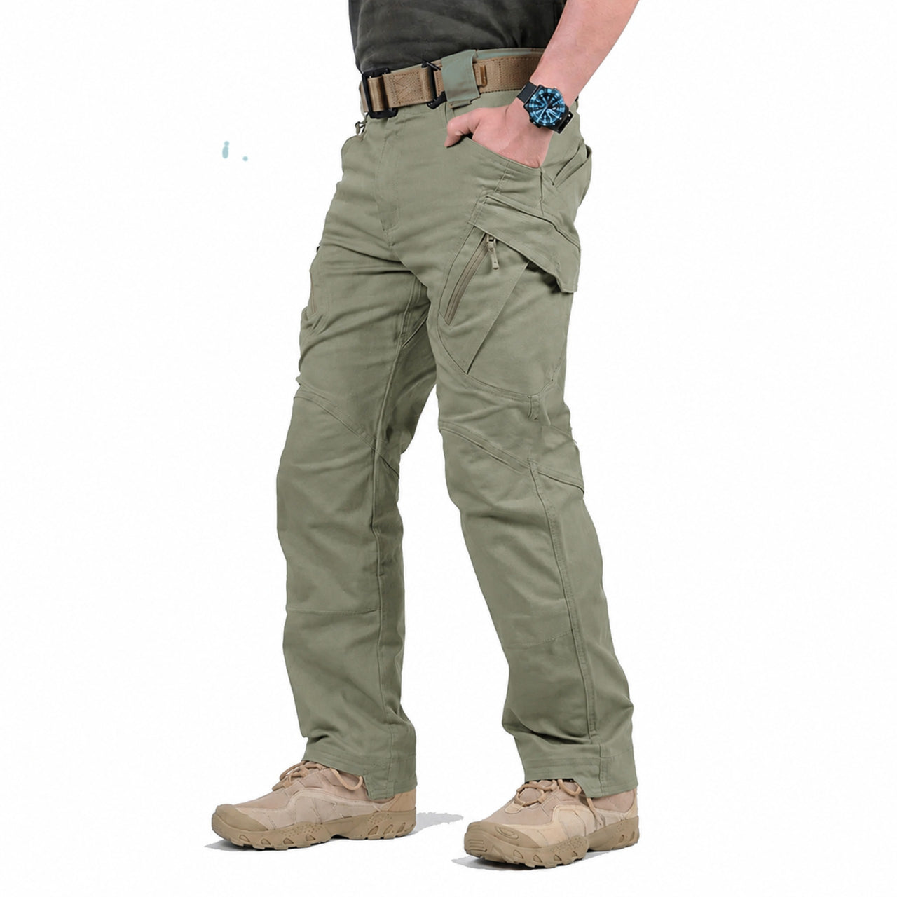 A person wearing sage green tactical cargo pants with a brown belt, a dark gray shirt, and tan boots, shown from the waist down on a white background.