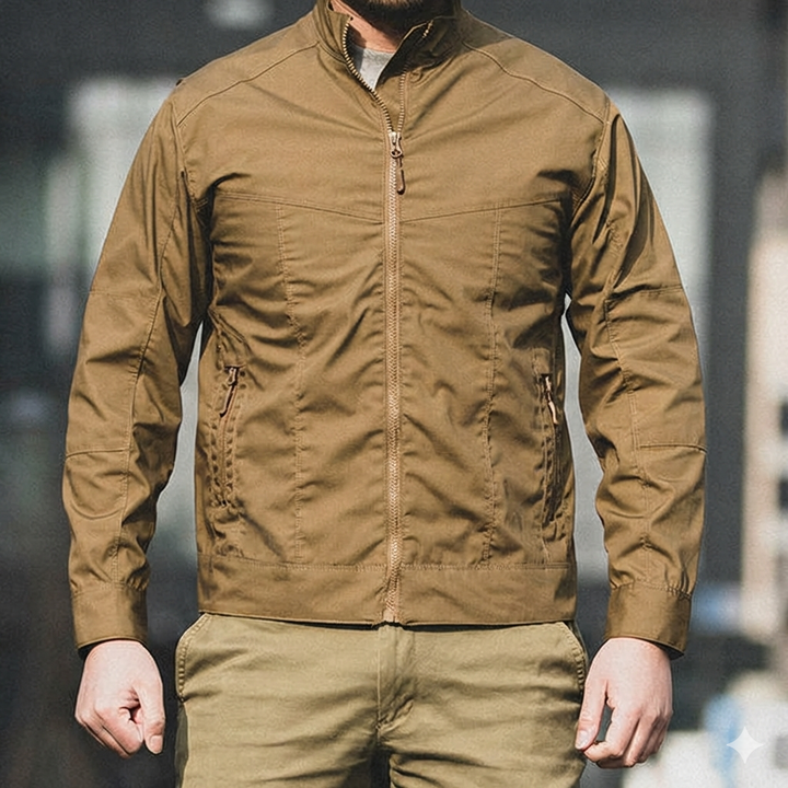 Person wearing a tactical brown jacket with a blurred background