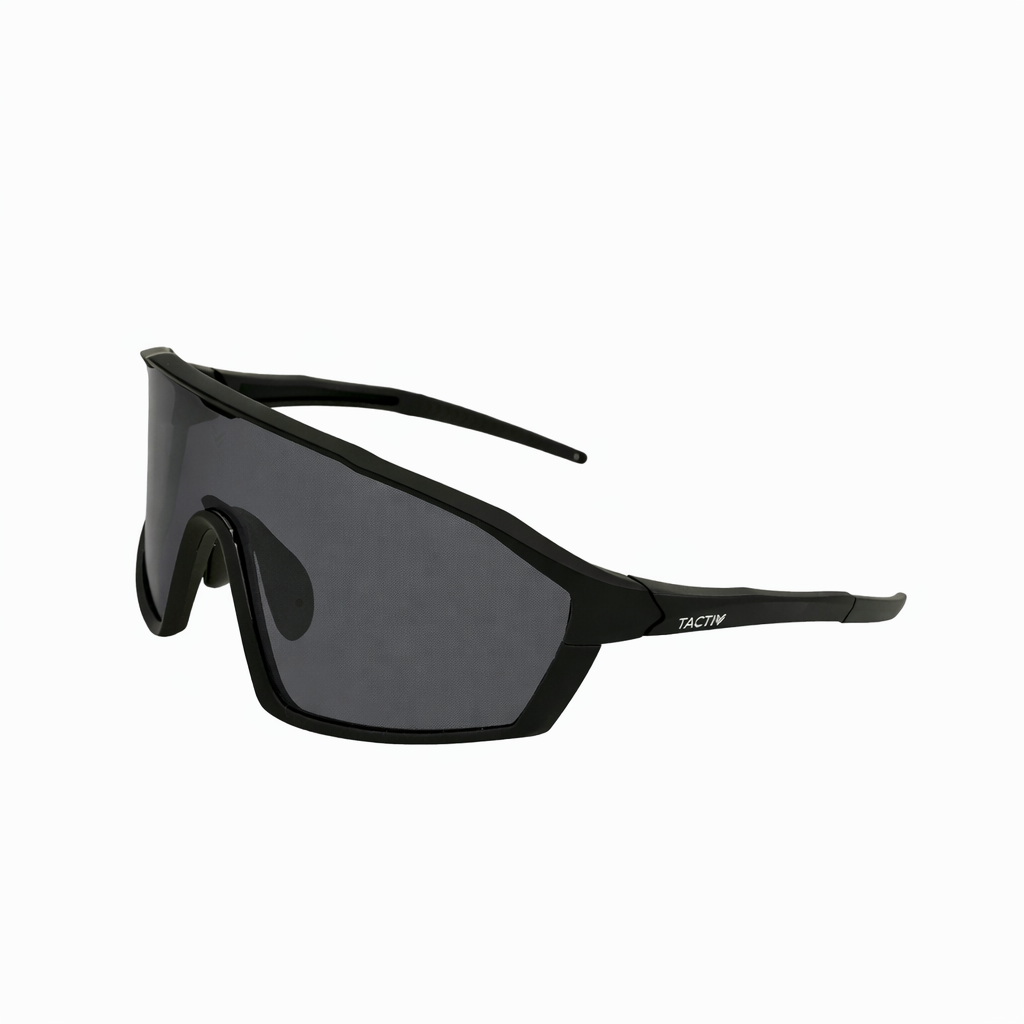 Left side angle view of Tactiv overwatch black photochromic eye shield with dark lens on a white background