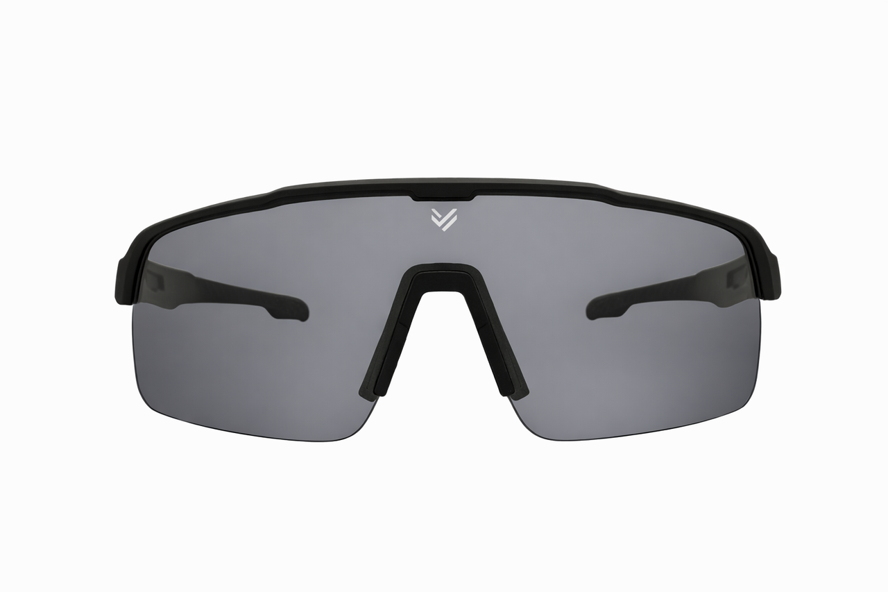 Front view of Tactiv Vantage black photochromic eye shield with dark lens  on a white background